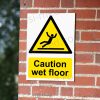 CA-SLIP-PORT-001-01-BRICK-WALL-WM Caution Wet Floor Warning Sign | A5, A4, A3 | Easi-Signs
